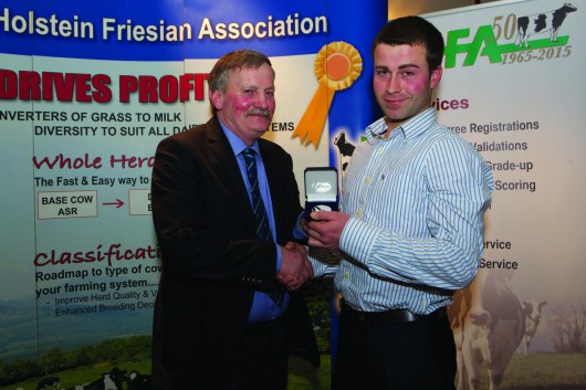 Padraic Murphy receives the Presidents Medal from IHFAChairman Richard Whelan
